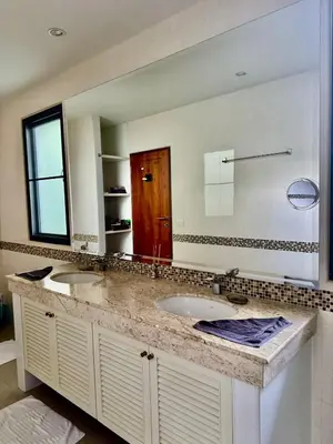 a bathroom with two sinks and a large mirror at Stunning 2-Bedroom Pool Villa in Ban Thalat Choeng Thale