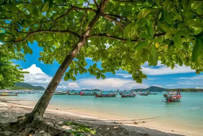 a view of a beach with boats in the water at Rawai beach 1br apartment at The Title in Rawai Beach