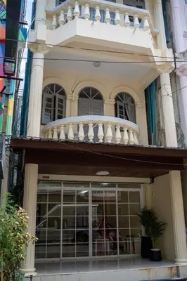 a building with a balcony on top of it at Beachfront 4-BR House in Patong in Patong Beach