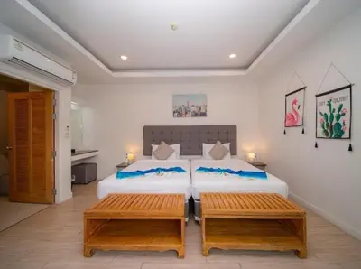 a bedroom with two beds and two benches at \u6cf0\u56fd\u666e\u5409\u5c9bYona\u8c6a\u534e\u6d77\u8fb9\u56db\u5367\u5ba44\u53f7 in Ban Bang La
