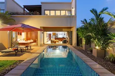 a swimming pool in the backyard of a house at The Residence Bangtao Villa 216 in Bang Tao Beach