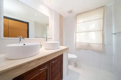a white bathroom with a sink and a toilet at Jungle Villa-private pool, BBQ near Kamala beach in Kamala Beach