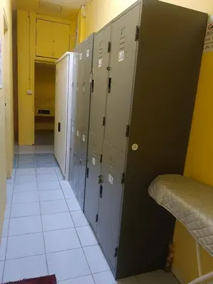 a row of lockers in a room with a hallway at 3Plus1 Hostel Patong in Patong Beach