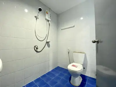 a bathroom with a toilet and a shower at Mini Thai Guesthouse Patong in Patong Beach