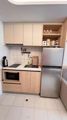 a kitchen with a sink and a refrigerator at Fantasea Condo Kamala beach 1BR apart B1 in Kamala Beach