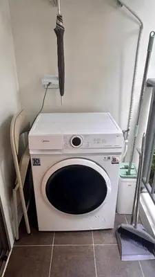 a washing machine with an umbrella on top of it at Fantasea Condo Kamala beach 1BR apart B1 in Kamala Beach