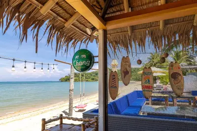 a restaurant on the beach with a view of the ocean at Phuket Moonlit Bay Seaview Resort & Spa in Phuket Town
