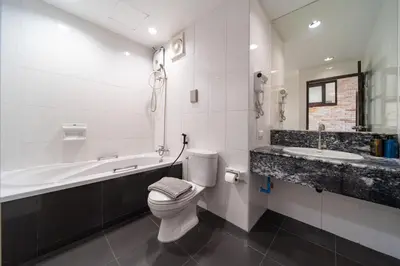 a bathroom with a toilet and a tub and a sink at PatongTower\u6b65\u884c\u76f4\u8fbe\u6d77\u6ee9\u9ad8\u901fwifi605S in Patong Beach