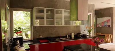 a kitchen with a sink and red cabinets and a window at 11 - Peaceful Escape on Naiyang Beach in Nai Yang Beach