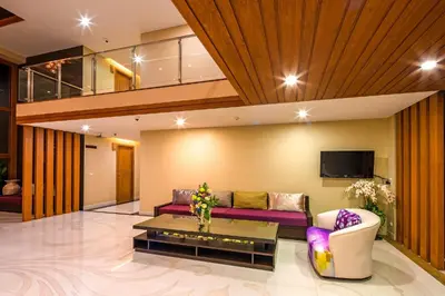 a living room with a couch and a table at At the tree by fatimah Rawai 408 in Rawai Beach
