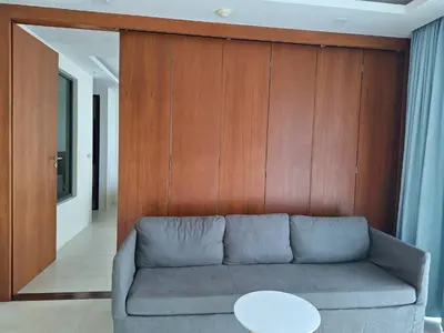 a living room with a couch and a table at At the tree by fatimah Rawai 408 in Rawai Beach