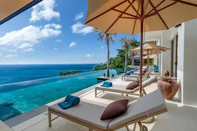 a villa with a view of the ocean at The Aquila Villa in Kamala Beach