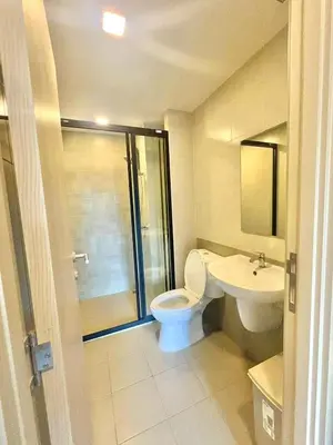 a bathroom with a toilet and a sink at Dcondo reef 99 in Kathu