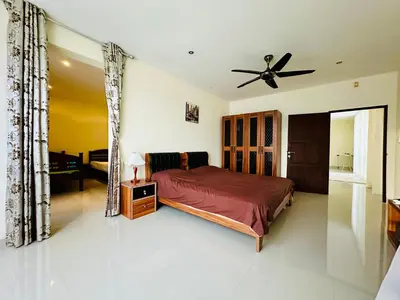a bedroom with a bed and a ceiling fan at Villa 3bd & pool - Rawai - Nai Harn in Rawai Beach