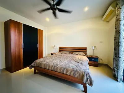 a bedroom with a bed and a ceiling fan at Villa 3bd & pool - Rawai - Nai Harn in Rawai Beach