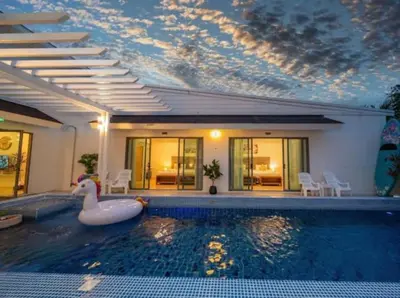 a swimming pool with a swan in the middle of a house at Elegant 4BR Villa with Pool2 in Ban Bang La