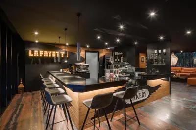 a bar with stools in a room with a counter at Enjoy Tropical Bliss in Kamala Pool View Suite CTG P204, Top Facilities, near FantaSea & Café Del Mar Beach Club in Kamala Beach