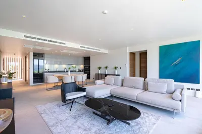 a living room with a couch and a table at Sea Views 2BR ,,Adult Only,, Apartment 817 in Sapphire Bay Residence, Patong in Patong Beach