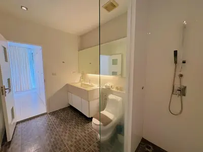 a bathroom with a toilet and a sink and a shower at Peaceful The Trees Kamala Hillside in Kamala Beach