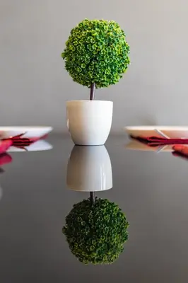 a plant in a white vase on a table at Modern Condo - 1BR T1 -501 in Chalong