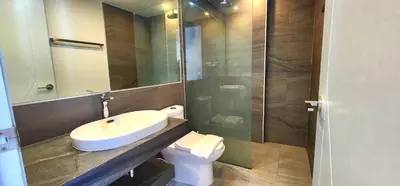 a bathroom with a sink and a toilet and a mirror at Cozy Apartment-1BR T2-524 in Chalong