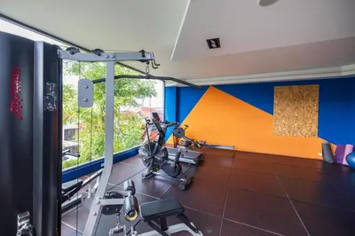 a room with a gym with a room with a simulator at Cozy Apartment-1BR T2-524 in Chalong