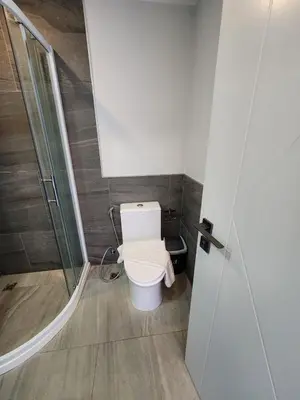 a bathroom with a toilet and a shower at Cozy Apt-1BR T3-635 in Chalong