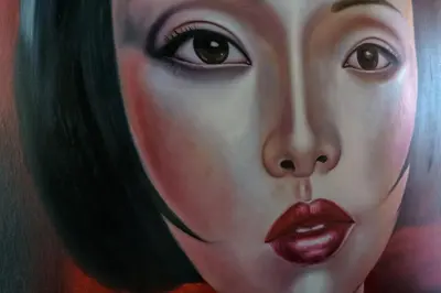 a painting of a woman with red lipstick at Henia Villa by G Estate Phuket in Ban Saiyuan (1)