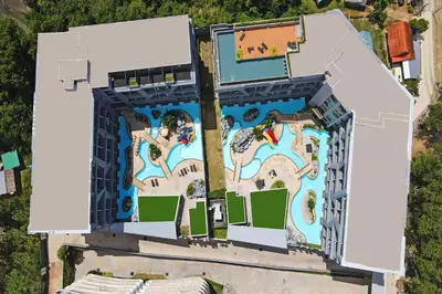 an aerial view of a building with a water park at Duplex Naiharn UTL A123 - Perfect Stay near Beach in Rawai Beach