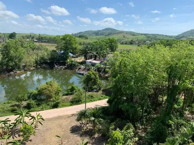 an aerial view of a river with trees at Студия мечтателя in Mai Khao Beach