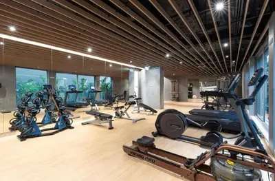 a gym with a bunch of exercise bikes in it at Luxury 3-Bedroom Sea View Apartment in MontAzure Kamala in Surin Beach