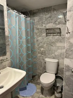 a bathroom with a toilet and a sink at New Apartment in 777 BEACH CONDO in Ban Mai Salae