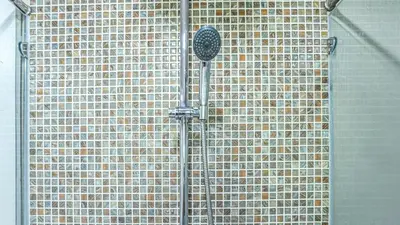 a metal wall with a shower in front of it at A New Experience of Private Vacation and Work in Patong in Patong Beach