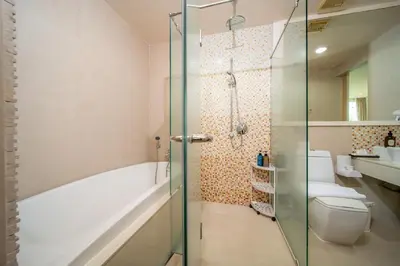 a bathroom with a tub and a toilet and a shower at A New Experience of Private Vacation and Work in Patong in Patong Beach