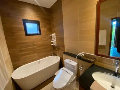 a bathroom with a tub and a toilet and a sink at Pool Villa Private near Rawai Beach 2 bedrooms 3D9 in Rawai Beach