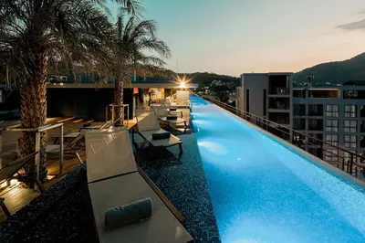 a large swimming pool on the roof of a building at Tropics Kamala 2BR Apartment CTG L602-3, Several Pools, Gym & Rooftop in Kamala Beach