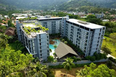 an aerial view of a building with a swimming pool at Enjoy Tropical Bliss in Kamala Suite CTG L704, Top Facilities, near FantaSea & Café Del Mar Beach Club in Kamala Beach