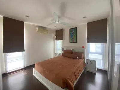 a bedroom with a bed and a ceiling fan at 4bdr Villa with gym and pool in Laguna #168 in Laguna Phuket