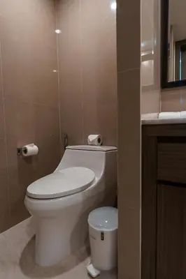 a bathroom with a white toilet and a sink at View 2Bdr Lux Life Rawai in Rawai Beach