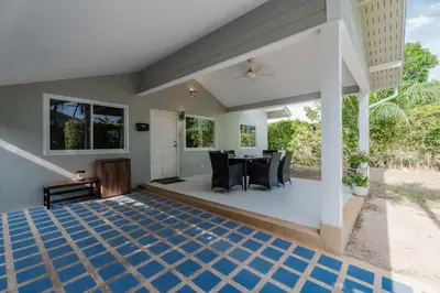 a dining room with a table and chairs at Flora 2 Bedroom HouseNear Naiharn - Rawai Beach in Rawai Beach