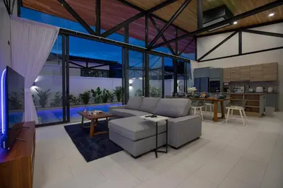 a living room with a couch and a table at 3BR Villa Sunset Garden 12 - Private 18m Pool in Rawai in Rawai Beach