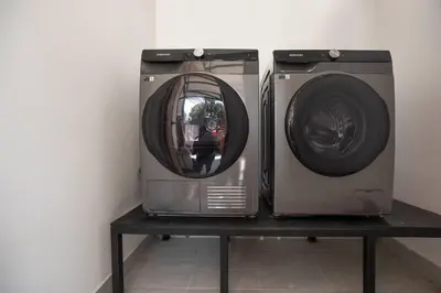 two washing machines sitting on a table next to each other at 3BR Villa Sunset Garden 12 - Private 18m Pool in Rawai in Rawai Beach