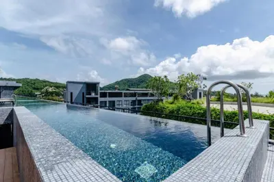 an infinity pool on the roof of a building at Green View Suite CTG P210 at Tropics Kamala Residence near Fantasea in Kamala Beach