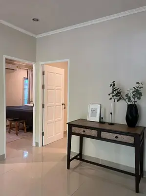 a room with a table with a plant on it at Home Tambon Bang tao 2BR Near Beach in Surin Beach