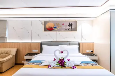 a bedroom with a bed with a swan decoration on it at Phuket Patong Buri Resort in Patong Beach