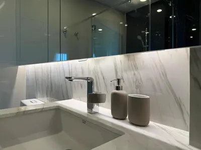 a bathroom with a sink and a mirror at Surin Mida Grande residence with jacuzzi and sea view - Bang Tao & Surin beach in Surin Beach