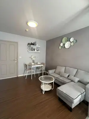 a living room with a couch and a table at Dcreek 79 Modern chic condo near patong in Phuket Town
