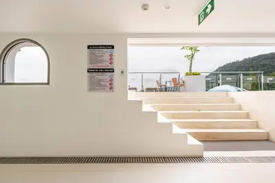 a staircase in a house with a view at Fantasea Kamala Walk to Beach Pool & Gym Modern 1BR in Kamala Beach