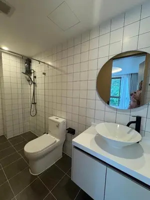 a bathroom with a toilet and a sink and a mirror at 1 bedroom in Kamala Beach in Kamala Beach
