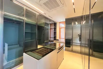 a kitchen with glass cabinets and a stove top oven at New & Exclusive! Private 4BR Zenithy Luxe Pool Villa near Laguna in Bang Tao Beach